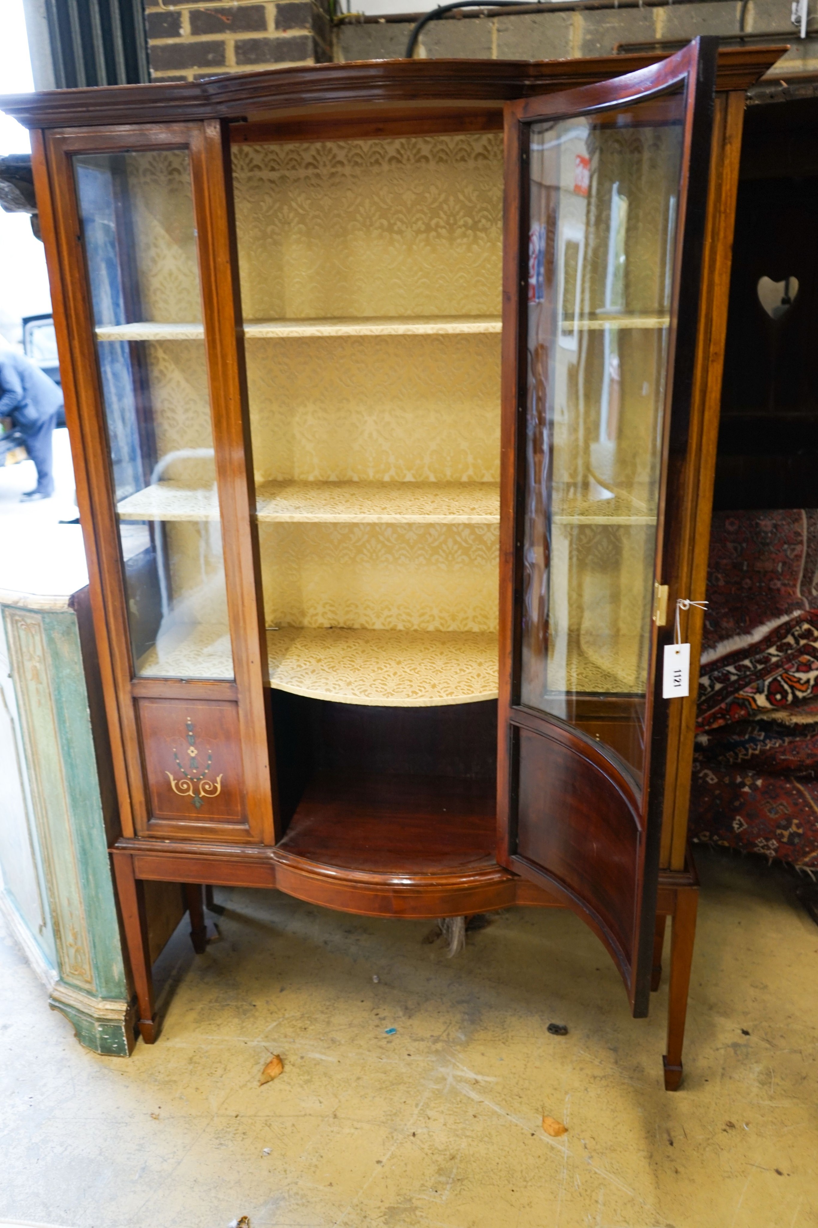 An Edwardian inlaid mahogany bow front display cabinet, width 115cm, depth 43cm, height 178cm